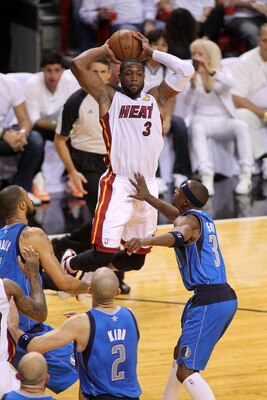 MIAMI, FL - JUNE 12:  Dwyane Wade #3 of the Miami Heat looks to pass the ball against the Dallas Mavericks in Game Six of the 2011 NBA Finals at American Airlines Arena on June 12, 2011 in Miami, Florida. NOTE TO USER: User expressly acknowledges and agre