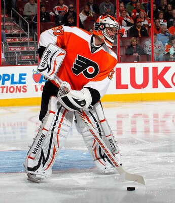PHILADELPHIA, PA - MARCH 22:  Goalie Brian Boucher #33 of the Philadelphia Flyers clears the puck during an NHL hockey game against the Washington Capitals at the Wells Fargo Center on March 22, 2011 in Philadelphia, Pennsylvania.  (Photo by Paul Bereswil
