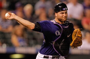 DENVER, CO - JUNE 13:  Catcher Chris Iannetta #20 of the Colorado Rockies throws out Jason Bartlett #8 of the San Diego Padres on a sacrafice bunt at Coors Field on June 13, 2011 in Denver, Colorado. (Photo by Justin Edmonds/Getty Images)