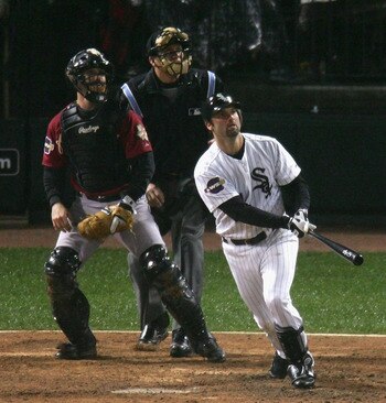 CHICAGO - OCTOBER 23:  Paul Konerko #14 of the Chicago White Sox hits a grand-slam home run against pitcher Chad Qualls #50 of the Houston Astros in the seventh inning during Game Two of the 2005 Major League Baseball World Series at U.S. Celluar Field on