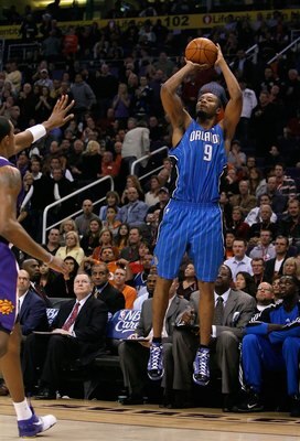 PHOENIX - DECEMBER 11:  Rashard Lewis #9 of the Orlando Magic puts up a three point shot during the NBA game against the Phoenix Suns at US Airways Center on December 11, 2009 in Phoenix, Arizona. The Suns defeated the Magic 106-103.  NOTE TO USER: User e