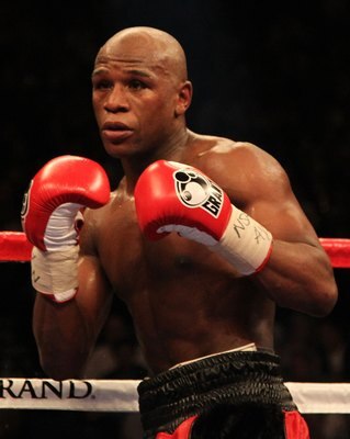 LAS VEGAS - MAY 01: Floyd Mayweather Jr. in action against Shane Mosley during their welterweight fight at the MGM Grand Garden Arena on May 1, 2010 in Las Vegas, Nevada. Mayweather Jr. defeated Mosley by unanimous decison.  (Photo by Jed Jacobsohn/Getty