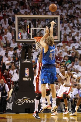 MIAMI, FL - JUNE 12:  Dirk Nowitzki #41 of the Dallas Mavericks attempts a shot against the Miami Heat in Game Six of the 2011 NBA Finals at American Airlines Arena on June 12, 2011 in Miami, Florida. NOTE TO USER: User expressly acknowledges and agrees t