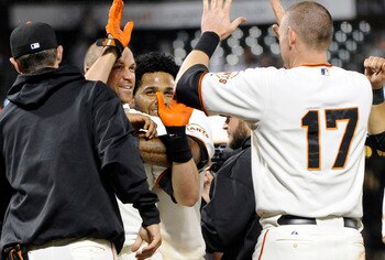Nate the Great gets mobbed after his walkoff HR in the 14th Wednesday.