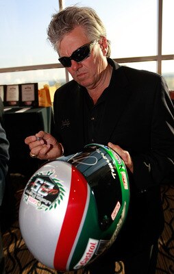 FORT WORTH, TX - APRIL 07:  NHRA Funny Car driver John Force autographs a helmet at the 2011 Texas Motorsports Hall of Fame at Texas Motor Speedway on April 7, 2011 in Fort Worth, Texas. (Photo by Tom Pennington/Getty Images)