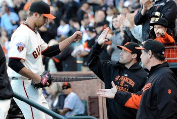 SAN FRANCISCO, CA - JUNE 26: Madison Bumgarner #40 of the San Francisco Giants gets congratulations from Pat Burrell (C) and manager Bruce Bochy (R) for his performance over seven innings against the Cleveland Indians during a MLB baseball game at AT&T Pa