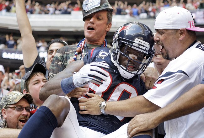 HOUSTON - OCTOBER 17:  Andre Johnson #80 of the Houston Texans is mobbed by fans after he scored the go ahead touchdown in the fourth quarter against the Kansas City Chiefs at Reliant Stadium on October 17, 2010 in Houston, Texas.  (Photo by Bob Levey/Get