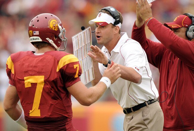 LOS ANGELES, CA - OCTOBER 16: Head Coach Lane Kiffin and Matt Barkley #7 of the USC Trojans react to a 3rd and 1 conversion against the California Golden Bears during the second quarter at Los Angeles Memorial Coliseum on October 16, 2010 in Los Angeles,