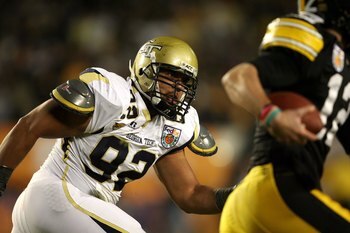 MIAMI GARDENS, FL - JANUARY 05:  Defensive lineman Jason Peters #92 of the Georgia Tech Yellow Jackets pressures the quarterback against the Iowa Hawkeyes during the FedEx Orange Bowl at Land Shark Stadium on January 5, 2010 in Miami Gardens, Florida. Iow