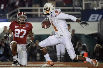 PASADENA, CA - JANUARY 07:  Wide receiver Dan Buckner #4 of the Texas Longhorns celebrates after a two-point conversion in front of cornerback Justin Woodall #27 of the Alabama Crimson Tide during the Citi BCS National Championship game at the Rose Bowl o