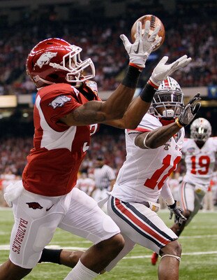 NEW ORLEANS, LA - JANUARY 04:  Joe Adams #3 of the Arkansas Razorbacks catches a 17-yard touchdown pass in the endzone against Travis Howard #18 of the Ohio State Buckeyes in the first quarter during the Allstate Sugar Bowl at the Louisiana Superdome on J
