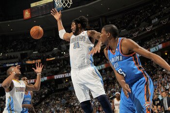 DENVER, CO - APRIL 25:  Arron Afflalo #6 of the Denver Nuggets and Nene Hilario #31 of the Denver Nuggets looks to collect a rebound away from Kevin Durant #35 of the Oklahoma City Thunder in Game Four of the Western Conference Quarterfinals in the 2011 N