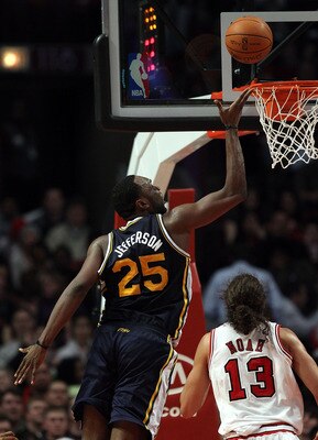 CHICAGO, IL - MARCH 12: Al Jefferson #25 of the Utah Jazz rolls in a shot over Joakim Noah #13 of the Chicago Bulls on his way to a game-high 33 points at the United Center on March 12, 2011 in Chicago, Illinois. The Bulls defeated the Jazz 118-100. NOTE