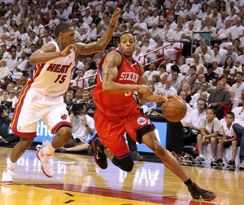MIAMI, FL - APRIL 27:  Andre Iguodala #9 of the Philadelphia 76ers drives to the rim past Mario Chalmers #15 of the Miami Heat  during game five of the Eastern Conference Quarterfinals in the 2011 NBA Playoffs at American Airlines Arena on April 27, 2011