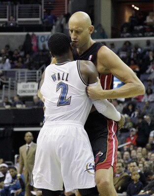 WASHINGTON, DC - MARCH 30:  John Wall #2 of the Washington Wizards and Zydrunas Ilgauskas #11 of the Miami Heat exchange words at the Verizon Center on March 30, 2011 in Washington, DC. NOTE TO USER: User expressly acknowledges and agrees that, by downloa