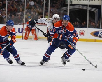 EDMONTON, CANADA - DECEMBER 17:  Sheldon Souray #44 and Sam Gagner #89  of the Edmonton Oilers break up ice against the Nashville Predators on December 17, 2009 at Rexall Place in Edmonton, Alberta, Canada. (Photo by Dale MacMillan/Getty Images)