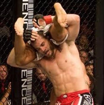 Jon Fitch finishing a double-leg take-down