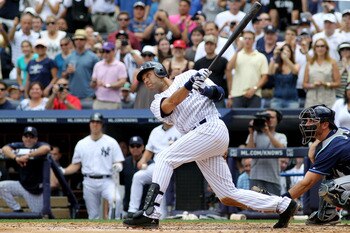 NEW YORK, NY - JULY 09:  Derek Jeter #2 of the New York Yankees hits a solo home run in the third inning for career hit 3000 while playing against the Tampa Bay Rays at Yankee Stadium on July 9, 2011 in the Bronx borough of New York City.  (Photo by Micha