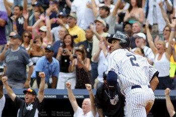NEW YORK, NY - JULY 09:  Derek Jeter #2 of the New York Yankees rounds the bases after hitting a solo home run in the third inning for career hit 3000 while playing against the Tampa Bay Rays at Yankee Stadium on July 9, 2011 in the Bronx borough of New Y