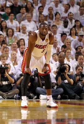 MIAMI, FL - JUNE 12:  Dwyane Wade #3 of the Miami Heat looks on against the Dallas Mavericks in Game Six of the 2011 NBA Finals at American Airlines Arena on June 12, 2011 in Miami, Florida. NOTE TO USER: User expressly acknowledges and agrees that, by do