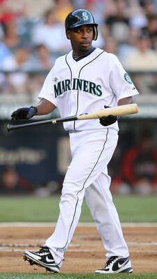 SEATTLE - JULY 24:  Chone Figgins #9 of the Seattle Mariners heads back to the dugout after hitting a bunt out in the first inning against the Boston Red Sox at Safeco Field on July 24, 2010 in Seattle, Washington. (Photo by Otto Greule Jr/Getty Images)
