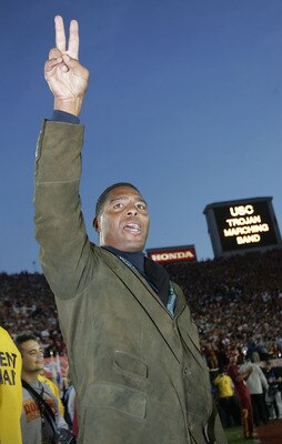 PASADENA, CA - JANUARY 04:  Former USC Trojans star Marcus Allen sings the team's fight song on the sidelines before the start of the BCS National Championship Rose Bowl Game against the Texas Longhorns on January 4, 2006 in Pasadena, California.  (Photo