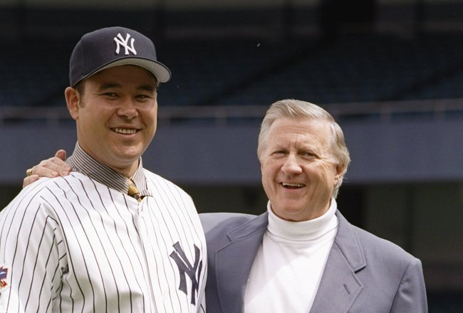 30 May 1997:  Pitcher Hideki Irabu and owner George Steinbrenner of the New York Yankees pose for a picture during a press conference at Yankee Stadium in Bronx, New York. Mandatory Credit: Al Bello  /Allsport