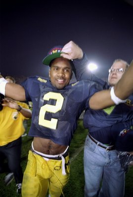 Wide receiver Charles Woodson of the Michigan Wolverines celebrates during the Rose Bowl against the Washington State Cougars at the Rose Bowl in Pasadena, California. Michigan won the game, 21-16.