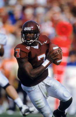 28 Oct 2000:  Michael Vick #7 of the Virginia Tech Hokies drops back to pass during the game against the Pittsburgh Panthers at Blacksburgh, Virginia. The Hokies defeated the Panthers 37-34.Mandatory Credit: Scott Halleran  /Allsport