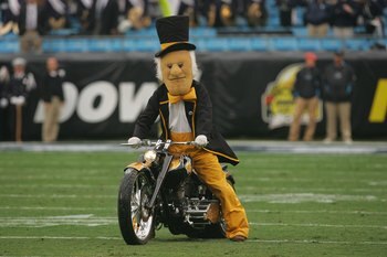 CHARLOTTE, NC - DECEMBER 29:  The mascot of the Wake Forest Demon Deacons rides a motorcycle onto the field to entertain the crowd during the game against the Connecticut Huskies at Bank of America Stadium on December 29, 2007 in Charlotte, North Carolina