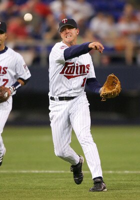 MINNEAPOLIS - JUNE 15:  Glenn Williams #16 of the Minnesota Twins sends the ball to first for the out against the San Francisco Giants on June 15, 2005 at the Hubert H. Humphrey Metrodome in Minneapolis, Minnesota.  (Photo by Elsa/Getty Images)