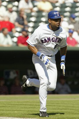 ARLINGTON, TX - SEPTEMBER 26:  Outfielder Ruben Rivera #24 of the Texas Rangers runs to first base against the Anaheim Angels on September 26, 2002 at the Ballpark in Arlington, TX.  The Angels won 10-5.  (Photo by Ronald Martinez/Getty Images)