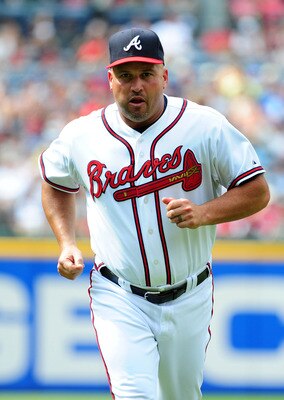 ATLANTA - JUNE 18: Manager Fredi Gonzalez #33 of the Atlanta Braves heads off the field during the game against the Texas Rangers at Turner Field on June 18, 2011 in Atlanta, Georgia. (Photo by Scott Cunningham/Getty Images)