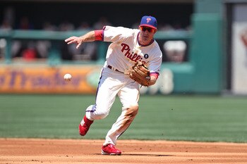 PHILADELPHIA - JULY 10: Second baseman Chase Utley #26 of the Philadelphia Phillies fields a ground ball during a game against the Atlanta Braves at Citizens Bank Park on July 10, 2011 in Philadelphia, Pennsylvania. (Photo by Hunter Martin/Getty Images)