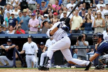NEW YORK, NY - JULY 09:  Derek Jeter #2 of the New York Yankees hits a solo home run in the third inning for career hit 3000 while playing against the Tampa Bay Rays at Yankee Stadium on July 9, 2011 in the Bronx borough of New York City.  (Photo by Micha