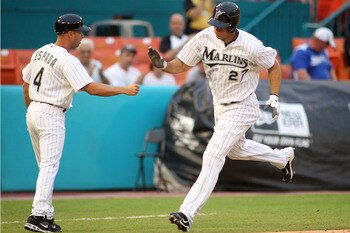 MIAMI GARDENS, FL - JULY 07:  Mike Stanton #27 of the Florida Marlins celebrates a two-run home run with third base coach Joey Espada #4 against the Houston Astros at Sun Life Stadium on July 7, 2011 in Miami Gardens, Florida.  (Photo by Marc Serota/Getty