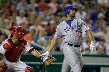 WASHINGTON, DC - JULY 07: Catcher Wilson Ramos #3 of the Washington Nationals looks on as Carlos Pena #22 of the Chicago Cubs follows his two run home run during the seventh inning at Nationals Park on July 7, 2011 in Washington, DC.  (Photo by Rob Carr/G