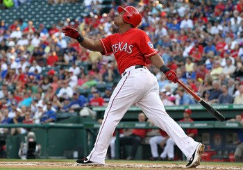 ARLINGTON, TX - JULY 06:  Adrian Beltre #29 of the Texas Rangers hits a sacrifice fly in the first inning against Baltimore Orioles at Rangers Ballpark in Arlington on July 6, 2011 in Arlington, Texas.  (Photo by Ronald Martinez/Getty Images)