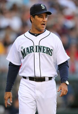 SEATTLE - JULY 24:  Manager Don Wakamatsu #22 of the Seattle Mariners heads back to the dugout after questioning a call in the first inning in which Chone Figgins #9 of the Mariners was called out on a bunt during the game against the Boston Red Sox at Sa