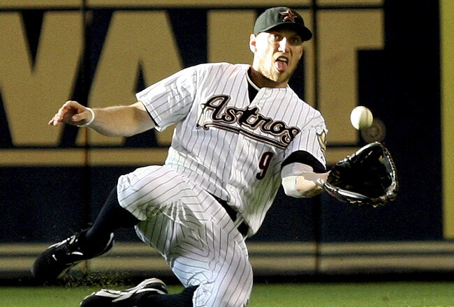 HOUSTON - JUNE 14:  Right fielder Hunter Pence #9 of the Houston Astros makes a sliding catch in the first inning against the Pittsburgh Pirates at Minute Maid Park on June 14, 2011 in Houston, Texas.  (Photo by Bob Levey/Getty Images)