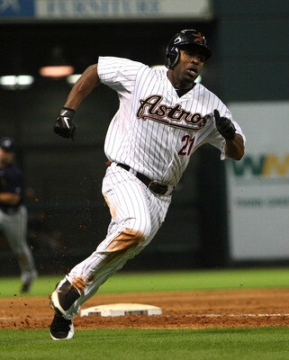 HOUSTON - JUNE 13:  Michael Bourn #21 of the Houston Astros scores in the sixth inning on a Hunter Pence single against the Atlanta Braves at Minute Maid Park on June 13, 2011 in Houston, Texas.  (Photo by Bob Levey/Getty Images)