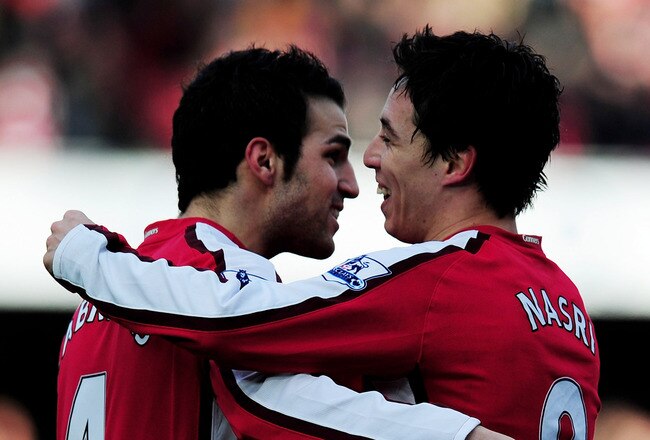 LONDON, ENGLAND - MARCH 06:  Cesc Fabregas of Arsenal celebrates with team mate Samir Nasri after scoring during the Barclays Premier League match between Arsenal and Burnley at Emirates Stadium on March 6, 2010 in London, England.  (Photo by Mike Hewitt/