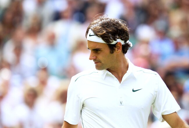 LONDON, ENGLAND - JUNE 29:  Roger Federer of Switzerland reacts during his quarterfinal round match against Jo-Wilfried Tsonga of France on Day Nine of the Wimbledon Lawn Tennis Championships at the All England Lawn Tennis and Croquet Club on June 29, 201