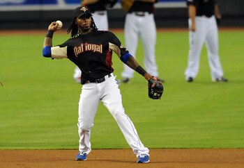 PHOENIX, AZ - JULY 11:  National League All-Star Jose Reyes #7 of the New York Mets throws the ball during the Gatorade All-Star Workout Day at Chase Field on July 11, 2011 in Phoenix, Arizona.  (Photo by Norm Hall/Getty Images)
