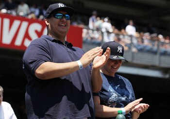 NEW YORK, NY - JULY 10:  Fan Christian Lopez, who caught the 3,000 hit ball of Derek Jeter, watches the game between the New York Yankees and the Tampa Bay Rays at Yankee Stadium on July 10, 2011 in the Bronx borough of New York City.  (Photo by Nick Laha