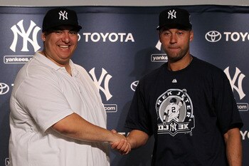 NEW YORK, NY - JULY 09:  New York Yankees fan Christian Lopez (L) shakes hands with Derek Jeter #2 of the New York Yankees  after catching a home run which was the 3000th of Derek Jeter's career at Yankee Stadium on July 9, 2011 in the Bronx borough of Ne