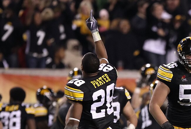TEMPE, AZ - DECEMBER 28:  (L-R) Shaun Prater #28, Markus Zusevics #56 and Jordan Bernstine #4 of the Iowa Hawkeyes celebrate after a turnover to the Missouri Tigers was overturned late in the fourth quarter of the Insight Bowl at Sun Devil Stadium on Dece