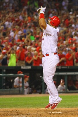 ST. LOUIS, MO - JULY 9: Albert Pujols #5 of the St. Louis Cardinals is celebrates after hitting a two-run home run against the Arizona Diamondbacks at Busch Stadium on July 9, 2011 in St. Louis, Missouri.  The Cardinals beat the Diamondbacks 7-6.  (Photo