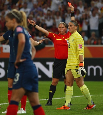 MOENCHENGLADBACH, GERMANY - JULY 05: Goalkeeper Berangere Sapowicz of France is sent off by referee Kirsi Heikkinen during the FIFA Women's World Cup 2011 Group A match between France and Germany at the Fifa Womens World Cup Stadium on July 5, 2011 in Moe