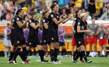 DRESDEN, GERMANY - JULY 10:  Abby Wambach (C) of USA celebrates during the penalty shoot out during the FIFA Women's World Cup 2011 Quarter Final match between Brazil and USA at Rudolf-Harbig-Stadion on July 10, 2011 in Dresden, Germany.  (Photo by Martin